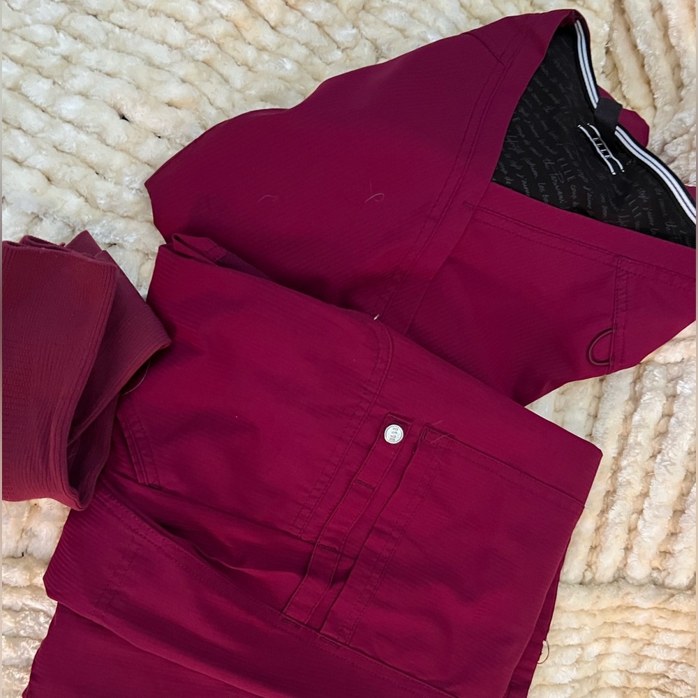 Ladies scrubs sets.  Maroon